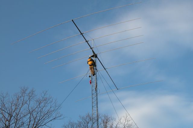 The new 20m 7-element Log-Yagi in position on the tower, with K1RX on the tower. Photo by Bruce Marton, K1XR.